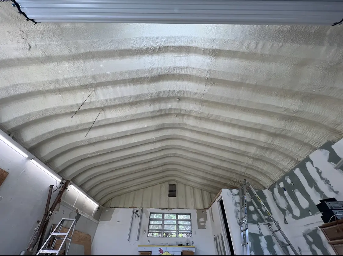Spray polyurethane foam applied to the underside of a metal roof deck in Waldwick